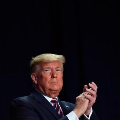 US President Donald Trump speaks at the 68th annual National Prayer Breakfast on February 6, 2020 in Washington,DC. - President Donald Trump said Thursday that he suffered a "terrible ordeal" during his impeachment. In his first public comments since being acquitted by the Senate of abuse of office, he said he had been "put through a terrible ordeal by some very dishonest and corrupt people." "They have done everything possible to destroy us and by so doing very badly hurt our nation," he said at a televised prayer breakfast with a Who's Who of Washington power brokers. (Photo by Nicholas Kamm / AFP)<!-- NICAID(14410906) -->