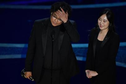 South Korean film director Bong Joon Ho accepts the award for Best Director for Parasite during the 92nd Oscars at the Dolby Theatre in Hollywood, California on February 9, 2020. (Photo by Mark RALSTON / AFP)<!-- NICAID(14413813) -->