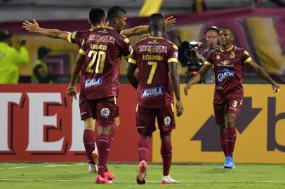 Colombias Tolima player Leandro Campaz (R) celebrates after scoring against Ecuadors Macara during their Copa Libertadores football match at Manuel Murillo Toro Stadium in Tolima, Colombia, on February 11, 2020. (Photo by Raul ARBOLEDA / AFP)