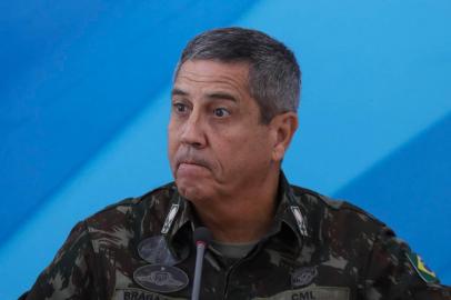 The General in charge of the military intervention in Rio de Janeiro Walter Souza Braga Netto, speaks during a press conference after Brazilian President Michel Temer signed a decree to send in the army to lead public safety in Rio de Janeiro state, at the Planalto Palace in Brasilia, on February 16, 2018.Army patrols are already used in Rios favelas ruled by drug gangs, but the decree will now give the military full control of security operations in Rio state, which the president said had virtually been seized by organized crime gangs. / AFP PHOTO / Sergio Lima<!-- NICAID(13416952) -->