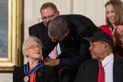 (FILES) In this file photo taken on November 24, 2015 former US President Barack Obama presents the Presidential Medal of Freedom to NASA mathematician and physicist Katherine Johnson at the White House in Washington, DC. - Katherine Johnson, whose calculations enabled Apollo 11 to land on the moon, died on February 24, 2020 at 101. Her story was told in the film Hidden Figures. (Photo by Nicholas KAMM / AFP)<!-- NICAID(14429897) -->