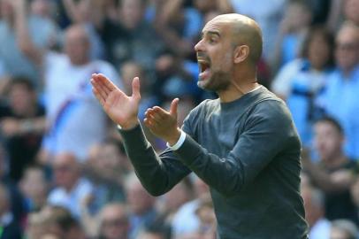 Manchester Citys Spanish manager Pep Guardiola gestures during the English Premier League football match between Manchester City and Tottenham Hotspur at the Etihad Stadium in Manchester, north west England, on April 20, 2019. (Photo by Lindsey PARNABY / AFP) / RESTRICTED TO EDITORIAL USE. No use with unauthorized audio, video, data, fixture lists, club/league logos or live services. Online in-match use limited to 120 images. An additional 40 images may be used in extra time. No video emulation. Social media in-match use limited to 120 images. An additional 40 images may be used in extra time. No use in betting publications, games or single club/league/player publications. / <!-- NICAID(14050159) -->