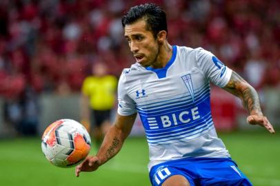 Chiles Universidad Catolica Edson Puch controls the ball during a 2020 Copa Libertadores match against Brazils Internacional at the Beira-Rio stadium, in Porto Alegre, Brazil, on March 3, 2020. (Photo by SILVIO AVILA / AFP)