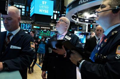 NEW YORK, NEW YORK - MARCH 10: Traders work on the floor of the New York Stock Exchange (NYSE) on March 10, 2020 in New York City. After losing nearly 8 percent in a market rout yesterday, the Dow Jones Industrial Average was up over 700 points in morning trading as investors look to a possible tax cut and other measures by the Trump administration to combat the coronavirus.   Spencer Platt/Getty Images/AFP<!-- NICAID(14446768) -->