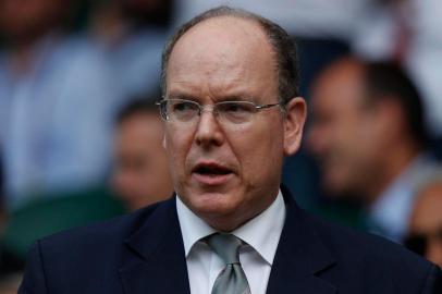 (FILES)This file photo taken on July 10, 2019 shows Prince Albert II of Monaco attending a match at the 2019 Wimbledon Championships at The All England Lawn Tennis Club in Wimbledon, southwest London. - Monacos Prince Albert II has tested positive for the novel coronavirus, the principality said in a statement on March 19, 2020, adding there were no concerns for his health. (Photo by Adrian DENNIS / AFP) / RESTRICTED TO EDITORIAL USE<!-- NICAID(14456001) -->