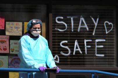 JERICHO, NEW YORK - APRIL 06: A Medical professional looks on at a drive-thru coronavirus testing site run by ProHealth Care on April 06, 2020 in Jericho, New York. The World Health Organization declared coronavirus (COVID-19) a global pandemic on March 11th.   Al Bello/Getty Images/AFP<!-- NICAID(14470240) -->