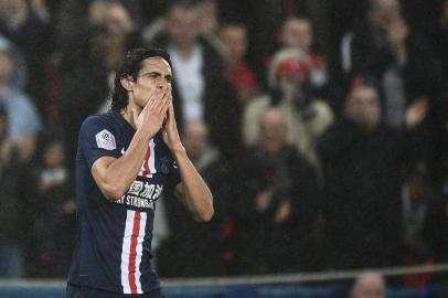 Paris Saint-Germains Uruguayan forward Edinson Cavani reacts after scoring a goal during the French L1 football match between Paris Saint-Germain (PSG) and Girondins de Bordeaux at the Parc des Princes stadium in Paris, on February 23, 2020. (Photo by Martin BUREAU / AFP)