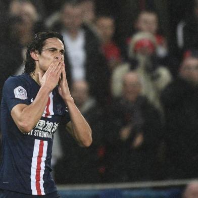 Paris Saint-Germains Uruguayan forward Edinson Cavani reacts after scoring a goal during the French L1 football match between Paris Saint-Germain (PSG) and Girondins de Bordeaux at the Parc des Princes stadium in Paris, on February 23, 2020. (Photo by Martin BUREAU / AFP)