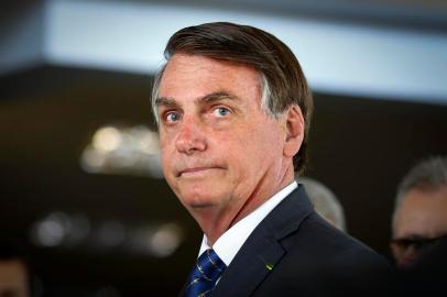  Brazilian President Jair Bolsonaro arrives for a press conference on electricity and gasoline at the Ministry of Mines and Energy in Brasilia, on January 15, 2020. - Bolsonaro spoke about Brazils possible entry to the Organisation for Economic Co-operation and Development (OECD). (Photo by Sergio LIMA / AFP)Editoria: POLLocal: BrasíliaIndexador: SERGIO LIMASecao: energy and resourceFonte: AFPFotógrafo: STR<!-- NICAID(14477927) -->