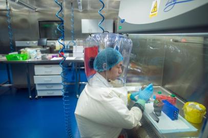 (FILES) This file photo taken on February 23, 2017 shows a worker inside the P4 laboratory in Wuhan, capital of Chinas Hubei province. - The P4 epidemiological laboratory was built in co-operation with French bio-industrial firm Institut Merieux and the Chinese Academy of Sciences. The facility is among a handful of labs around the world cleared to handle Class 4 pathogens (P4) - dangerous viruses that pose a high risk of person-to-person transmission. (Photo by JOHANNES EISELE / AFP)<!-- NICAID(14481352) -->