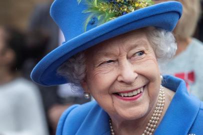 (FILES) In this file photo taken on October 11, 2019 Britains Queen Elizabeth II reacts as she visits the Haig Housing Trust in Morden, southwest London, to open their new veteran housing development. - Britains Queen Elizabeth II will not celebrate her birthday on Tuesday with a traditional gun salute due to the coronavirus crisis, Buckingham Palace said on Saturday.  There will be no gun salutes. Her Majesty was keen that no special measures were put in place to allow gun salutes as she did not feel it appropriate in the current circumstances, the palace told AFP. The queen, who turns 94 on April 21, 2020, made a rare national address at Easter, saying that we know that coronavirus will not overcome us and that we will meet again after the countrys lockdown is lifted. (Photo by Jack Hill / POOL / AFP)<!-- NICAID(14482525) -->