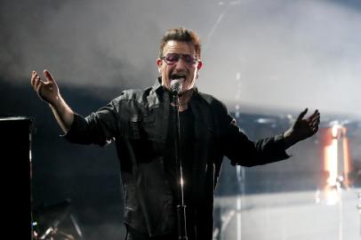 Irish singer-songwriter Bono performs with his band U2 during the Bambi awards on November 13, 2014 in Berlin. The Bambis are the main German media awards.     AFP PHOTO / DPA / WOLFGANG KUMM / GERMANY OUT<!-- NICAID(10997163) -->