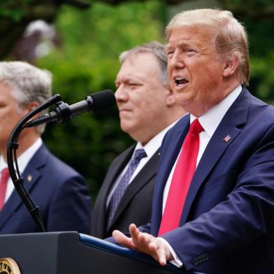 US National Security Advisor Robert OBrien, and Secretary of State Mike Pompeo look on as US President Donald Trump speaks during a press conference on China in the Rose Garden of the White House in Washington, DC on May 29, 2020. - Trump held the press conference amid soaring tensions between the two powers, including over the status of Hong Kong and the novel coronavirus pandemic. (Photo by MANDEL NGAN / AFP)<!-- NICAID(14511214) -->