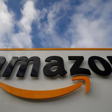 (FILES) A file photo taken on November 28, 2019  shows the Amazon logo at one of the company's centre in Bretigny-sur-Orge. - Masks for all French employees, temperature control throughout the network: the American giant of online retail group Amazon reacted on April 3, 2020 to the grumbling of its employees, without really calming concerns over the coronavirus epidemic. (Photo by Thomas SAMSON / AFP)<!-- NICAID(14474509) -->