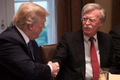 Trump briefing with US military leaders as mulls response to suspected chemical attack in Syria US President Donald Trump speaks during a meeting with senior military leaders at the White House in Washington, DC, on April 9, 2018. At right is new National Security Advisor John Bolton. - President Donald Trump said Monday that major decisions would be made on a Syria response in the next day or two, after warning that Damascus would have a big price to pay over an alleged chemical attack on a rebel-held town.Trump condemned what he called a heinous attack on innocent Syrians in Douma, as he opened a cabinet meeting at the White House. (Photo by NICHOLAS KAMM / AFP)Editoria: POLLocal: WashingtonIndexador: NICHOLAS KAMMSecao: governmentFonte: AFPFotógrafo: STF