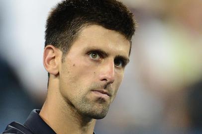 Serbias Novak Djokovic celebrates defeating Argentinas Juan Martin Del Potro 6-2, 7-6 (7/3), 6-4 in the 2012 US Open mens singles quarterfinals at the USTA Billie Jean King National Tennis Center in New York on September 6, 2012.   AFP PHOTO/Emmanuel Dunand<!-- NICAID(8587112) -->