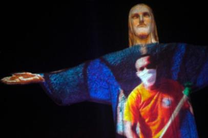 The Christ the Redeemer statue is seen illuminated to pay tribute to victims of novel COVID-19 coronavirus disease in Rio de Janeiro, Brazil on July 01, 2020. The novel coronavirus has killed at least 512,383 people since the outbreak emerged in China last December, according to a tally from official sources compiled by AFP at 1900 GMT on Wednesday. Brazil counts nearly 60,000 deaths from more than 1.4 million cases.MAURO PIMENTEL / AFP<!-- NICAID(14535939) -->