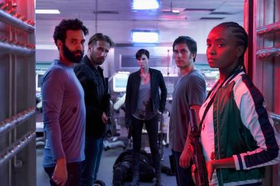 THE OLD GUARD (2020) -  (L to R) Marwan Kenzari as Joe,  Matthias Schoenaerts as Booker, Charlize Theron as Andy,  Luca Marinelli as Nicky, Kiki Layne as Nile. Photo Credit: AIMEE SPINKS/NETFLIX ©2020<!-- NICAID(14539511) -->