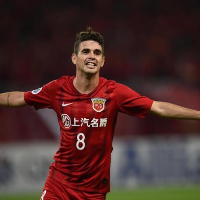 (FILES) This file photo taken on May 21, 2019 shows Shanghai SIPG's Oscar celebrating after scoring a goal during the AFC Champions League football match between Shanghai SIPG and Ulsan Hyundai in Shanghai. - Some players have brought their own pillows and one a box of Lego as the Chinese Super League (CSL) launches on July 25, 2020 in a tightly controlled environment designed to thwart the coronavirus. (Photo by Hector RETAMAL / AFP) / TO GO WITH Fbl-Asia-CHN-CSL-health-virus,PREVIEW by Peter STEBBINGS