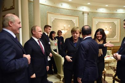 Belarus President Alexander Lukashenko, Russian President Vladimir Putin, German Chancellor Angela Merkel, Frances President Francois Hollande and Ukrainian President Petro Poroshenko (front L-R) attend a meeting on February 11, 2015 in Minsk aimed at halting a 10-month war in Ukraine where dozens were killed in the latest fighting. AFP PHOTO / UKRAINIAN PRESIDENTIAL PRESS SERVICE / POOL / MYKOLA LAZARENKO<!-- NICAID(11187973) -->