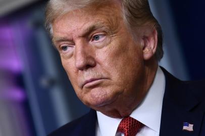 (FILES) In this file photo US President Donald Trump speaks to the press in the Brady Briefing Room of the White House in Washington, DC, on August 10, 2020. - President Donald Trump said on August 11, 2020 that some men may feel insulted by his Democratic rival Joe Bidens committment to choose a woman as his vice presidential candidate.He roped himself into a certain group of people, Trump told Fox Sports Radio in an early morning phone-in interview.Some people would say men are insulted by that and some people would say it is fine, Trump said. (Photo by Brendan Smialowski / AFP)<!-- NICAID(14565276) -->