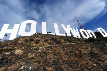 The freshly painted Hollywood sign is seen after a press conference to announce the completion of the famous landmark's major makeover on December 4, 2012 in Hollywood, California. Some 360 gallons (around 1,360 liters) of paint and primer were used to provide the iconic sign with its most extensive refurbishment in almost 35 years in advance of its 90th birthday next year.     AFP PHOTO / Robyn Beck<!-- NICAID(8880046) -->