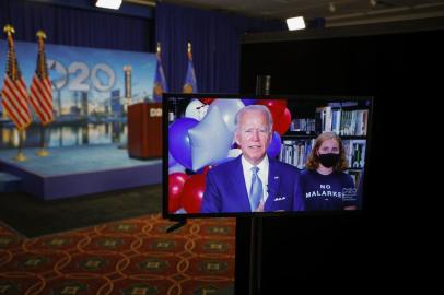 MILWAUKEE, WISCONSIN - AUGUST 18: Democratic presidential nominee former Vice President Joe Biden reacts in a video feed from Delaware after winning the votes to become the Democratic Partys 2020 nominee for president during the second night of the 2020 Democratic National Convention on August 18, 2020 in Milwaukee, Wisconsin. Once expected to draw 50,000 people to Milwaukee, the convention is now taking place virtually due to the coronavirus (COVID-19) pandemic.   Brian Snyder-Pool/Getty Images/AFP