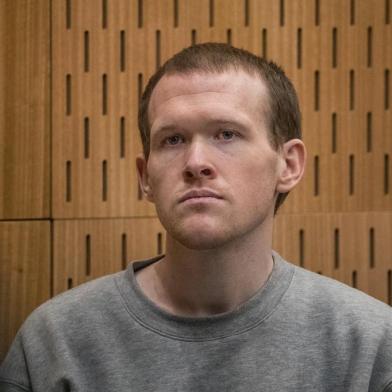 Australian white supremacist Brenton Tarrant listens as Crown prosecutor Mark Zarifeh delivers his submission in court in Christchurch on August 27, 2020. - New Zealand mosque gunman Brenton Tarrant was sentenced to life in prison without parole on August 27 for the massacre of 51 Muslim worshippers, with a judge calling him wicked and inhuman. (Photo by JOHN KIRK-ANDERSON / POOL / AFP)<!-- NICAID(14577849) -->