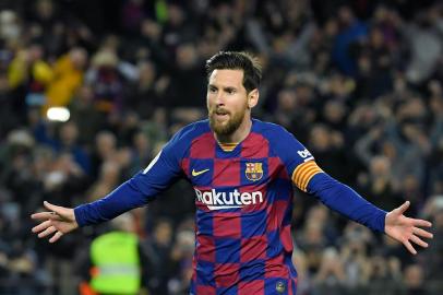 (FILES) In this file photo taken on March 07, 2020, Barcelonas Argentine forward Lionel Messi celebrates after scoring a goal during the Spanish league football match between FC Barcelona and Real Sociedad at the Camp Nou stadium in Barcelona, Spain. - Lionel Messi said on September 4, 2020 that he will stay at Barcelona, insisting he could never go to court against the club of his life. (Photo by LLUIS GENE / AFP)<!-- NICAID(14584804) -->