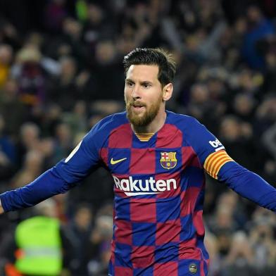 (FILES) In this file photo taken on March 07, 2020, Barcelonas Argentine forward Lionel Messi celebrates after scoring a goal during the Spanish league football match between FC Barcelona and Real Sociedad at the Camp Nou stadium in Barcelona, Spain. - Lionel Messi said on September 4, 2020 that he will stay at Barcelona, insisting he could never go to court against the club of his life. (Photo by LLUIS GENE / AFP)<!-- NICAID(14584804) -->