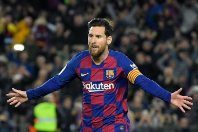 (FILES) In this file photo taken on March 07, 2020, Barcelonas Argentine forward Lionel Messi celebrates after scoring a goal during the Spanish league football match between FC Barcelona and Real Sociedad at the Camp Nou stadium in Barcelona, Spain. - Lionel Messi said on September 4, 2020 that he will stay at Barcelona, insisting he could never go to court against the club of his life. (Photo by LLUIS GENE / AFP)