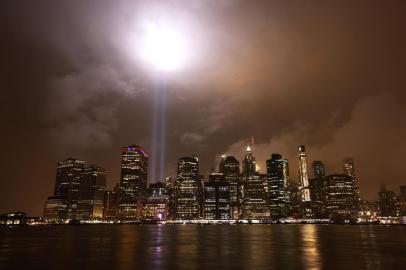 NEW YORK, NEW YORK - SEPTEMBER 10: The 9/11 Tribute in Light shines above the lower Manhattan skyline on September 10, 2020 in New York City. The National September 11 Memorial & Museums annual Tribute in Light was initially cancelled this year due to the coronavirus (COVID-19) pandemic. However, New York Gov. Andrew Cuomo reversed this decision, announcing that the state will provide health personnel and supervision to maintain the light installation.   Michael M. Santiago/Getty Images/AFP<!-- NICAID(14589704) -->