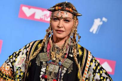 (FILES) In this file photo taken on August 20, 2018 Madonna poses in the press room at the 2018 MTV Video Music Awards at Radio City Music Hall in New York City. - Madonna has revealed that her next project will be the movie of her life -- and the final product should meet with her approval as she is bringing it to the screen herself. The 62-year-old Material Girl, whose four-decade career as a singer, actress and cultural touchstone has taken in sex, religion and other traditional taboos, will direct the biopic, according to a statement from movie studio Universal. (Photo by ANGELA WEISS / AFP)<!-- NICAID(14593413) -->