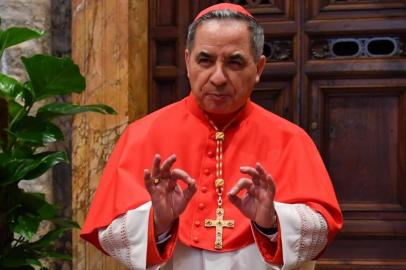 (FILES) In this file photo taken on June 28, 2018 Newly elevated cardinal, Giovanni Angelo Becciu from Italy, attends the courtesy visit of relatives following a consistory for the creation of new cardinals on June 28, 2018 in the Apostolic Palace at St Peters basilica in Vatican. - Cardinal Angelo Becciu, the head of the vaticans saint-making office, resigned, the Vatican said in a statement on September 24, 2020. Becciu was reportedly indirectly implicated in a financial scandal involving the Vaticans investment in a London real estate deal. (Photo by ANDREAS SOLARO / AFP)<!-- NICAID(14600876) -->