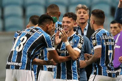  Brazils Gremio forward Pepe celebrates with teammates after scoring againt Chiles Universidad Catolica during their closed-door Copa Libertadores group phase football match at the Arena do Gremio stadium in Porto Alegre, Brazil, on September 29, 2020, amid the COVID-19 novel coronavirus pandemic. (Photo by Alexandre Schneider / various sources / AFP)Editoria: SPOLocal: Porto AlegreIndexador: ALEXANDRE SCHNEIDERSecao: soccerFonte: AFPFotógrafo: STR<!-- NICAID(14604789) -->