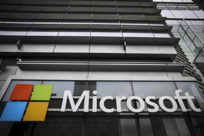 (FILES) In this file photo the Microsoft logo is displayed outside the Microsoft Technology Center near Times Square, June 4, 2018 in New York City. - Microsoft on October 20, 2020 said its Azure cloud computing service is taking to outer space, and will deliver datacenter power to remote spots on Earth in the process. The US technology titan announced partnerships with satellite operators including SpaceX, founded by Elon Musk, as part an ecosystem to serve networking needs in orbit as well as beam high-speed internet connections to modular datacenters that can be deployed almost anywhere. (Photo by Drew Angerer / GETTY IMAGES NORTH AMERICA / AFP)<!-- NICAID(14621235) -->