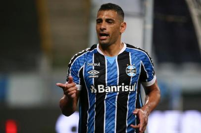  Brazils Gremio Diego Souza celebrates after scoring a penalty against Colombias America de Cali during their closed-door Copa Libertadores group phase football match at the Arena do Gremio stadium in Porto Alegre, Brazil, on October 22, 2020, amid the COVID-19 novel coronavirus pandemic. (Photo by DIEGO VARA / POOL / AFP)Editoria: SPOLocal: Porto AlegreIndexador: DIEGO VARASecao: soccerFonte: POOLFotógrafo: STR<!-- NICAID(14623931) -->