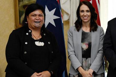 (FILES) This file photo taken on February 28, 2020 shows New Zealands Prime Minister Jacinda Ardern (R) and New Zealands then-Minister of Maori Development and Local Government (L) Nanaia Mahuta posing for photographs after the signing of the Indigenous Collaboration Arrangement with their Australian counterparts at Admiralty House in Sydney. - Ardern named an incredibly diverse cabinet on November 2, 2020 that includes New Zealands first openly gay deputy prime minister and a foreign minister with a Maori facial tattoo. (Photo by BIANCA DE MARCHI / POOL / AFP)<!-- NICAID(14633707) -->