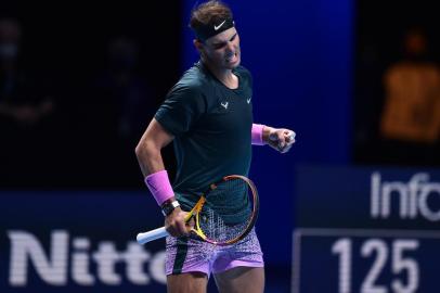 775587883Spains Rafael Nadal celebrates beating Russias Andrey Rublev in their mens singles round-robin match on day one of the ATP World Tour Finals tennis tournament at the O2 Arena in London on November 15, 2020. (Photo by Glyn KIRK / AFP)Editoria: SPOLocal: LondonIndexador: GLYN KIRKSecao: tennisFonte: AFPFotógrafo: STR<!-- NICAID(14643950) -->