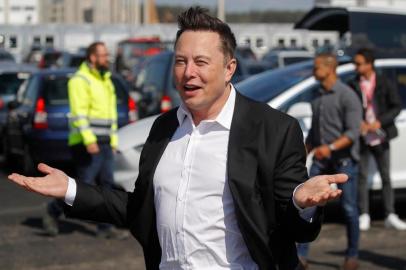 (FILES) This file photo taken on September 3, 2020 shows Tesla CEO Elon Musk gesturing as he arrives to visit the construction site of the future US electric car giant Tesla, in Gruenheide near Berlin. - The boom in demand for placing small satellites into orbit has boosted interest in small rockets, but industry players do not think the niche will become a business segment of its own. (Photo by Odd ANDERSEN / AFP)<!-- NICAID(14646386) -->