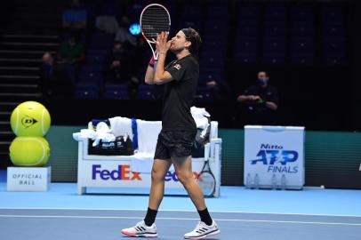 775587889Austrias Dominic Thiem reacts after his victory over Serbias Novak Djokovic in their mens singles semi-final match on day seven of the ATP World Tour Finals tennis tournament at the O2 Arena in London on November 21, 2020. - Thiem won the match 7-5, 6-7, 7-6 (Photo by Glyn KIRK / AFP)Editoria: SPOLocal: LondonIndexador: GLYN KIRKSecao: tennisFonte: AFPFotógrafo: STR<!-- NICAID(14649885) -->