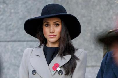 Meghan Markle, the US fiancee of Britains Prince Harry, attends an Anzac Day dawn service at Hyde Park Corner in London on April 25, 2018. Anzac Day commemorates Australian and New Zealand casualties and veterans of conflicts and marks the anniversary of the landings in the Dardanelles on April 25, 1915 that would signal the start of the Gallipoli Campaign during the First World War.  / AFP PHOTO / POOL AND AFP PHOTO / Tolga AKMEN