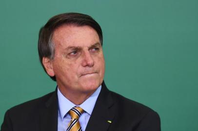 Brazilian President Jair Bolsonaro gestures during the commemoration of the 54th anniversary of the creation of Brazils Tourism Board (EMBRATUR) at Planalto Palace in Brasilia, on November 17, 2020. (Photo by EVARISTO SA / AFP)<!-- NICAID(14649871) -->