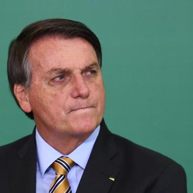 Brazilian President Jair Bolsonaro gestures during the commemoration of the 54th anniversary of the creation of Brazils Tourism Board (EMBRATUR) at Planalto Palace in Brasilia, on November 17, 2020. (Photo by EVARISTO SA / AFP)<!-- NICAID(14649871) -->