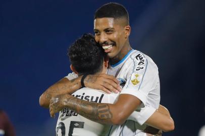  Brazils Gremio Jean Pyerre celebrates with teammate Pepe after scoring against Paraguays Guarani during their closed-door Copa Libertadores round before the quarterfinals football match at the Defensores del Chaco stadium in Asuncion, on November 26, 2020. (Photo by Nathalia Aguilar / POOL / AFP)Editoria: SPOLocal: AsuncionIndexador: NATHALIA AGUILARSecao: soccerFonte: POOLFotógrafo: STR<!-- NICAID(14654044) -->