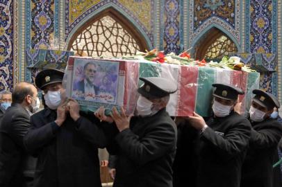 A handout picture provided by Irans Defence Ministry on November 29, 2020 shows Servants of the holy shrine of Imam Reza carrying the coffin of Irans assassinated top nuclear scientist Mohsen Fakhrizadeh during his funeral procession in the northeastern city of Mashhad. - The body of Irans assassinated top nuclear scientist has been taken to the first of several revered Shiite Muslim shrines ahead of his burial set for November 30, state media reported. The killing of Fakhrizadeh -- whom Israel has dubbed the father of Irans nuclear programme -- has once more heightened tensions between the Islamic republic and its foes. (Photo by - / IRANIAN DEFENCE MINISTRY / AFP) / ==  RESTRICTED TO EDITORIAL USE - MANDATORY CREDIT AFP PHOTO / HO /IRANIAN DEFENCE MINISTRY - NO MARKETING NO ADVERTISING CAMPAIGNS - DISTRIBUTED AS A SERVICE TO CLIENTS ==<!-- NICAID(14656034) -->