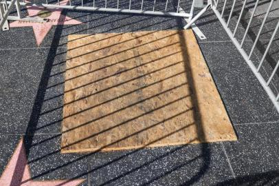 LOS ANGELES, CALIFORNIA - DECEMBER 06: President Donald Trumps star on the Hollywood Walk of Fame is seen behind a barrier and boarded up on December 06, 2020 in Los Angeles, California.   Rich Fury/Getty Images/AFP<!-- NICAID(14663678) -->