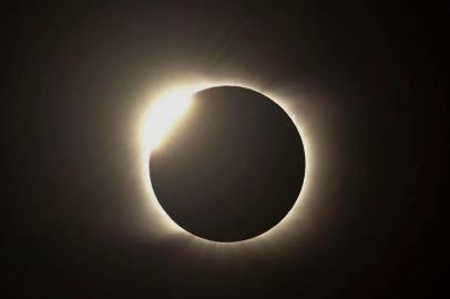 The diamond ring effect is seen during the total solar eclipse from Piedra del Aquila, Neuquen province, Argentina on December 14, 2020. (Photo by RONALDO SCHEMIDT / AFP)<!-- NICAID(14668268) -->