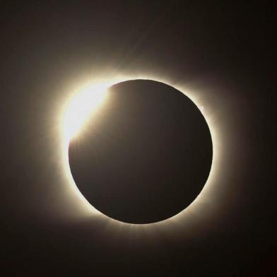 The diamond ring effect is seen during the total solar eclipse from Piedra del Aquila, Neuquen province, Argentina on December 14, 2020. (Photo by RONALDO SCHEMIDT / AFP)<!-- NICAID(14668268) -->