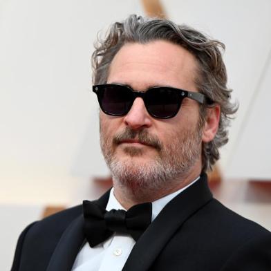 (FILES) In this file photo taken on February 09, 2020 US actor Joaquin Phoenix arrives for the 92nd Oscars at the Dolby Theatre in Hollywood, California. - Joaquin Phoenixs latest film isnt an easy watch -- and given its stark anti-meat agenda, it isnt meant to be.The Joker star and vegan activist executive-produced Gunda, a stripped-down, black-and-white movie delivering intimate portraits of a cast of adorable farmyard animals. (Photo by Robyn Beck / AFP)<!-- NICAID(14668805) -->